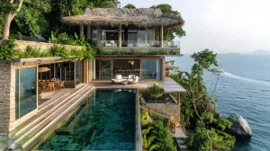 Modern cliffside villa in Samui with an infinity pool overlooking the ocean.
