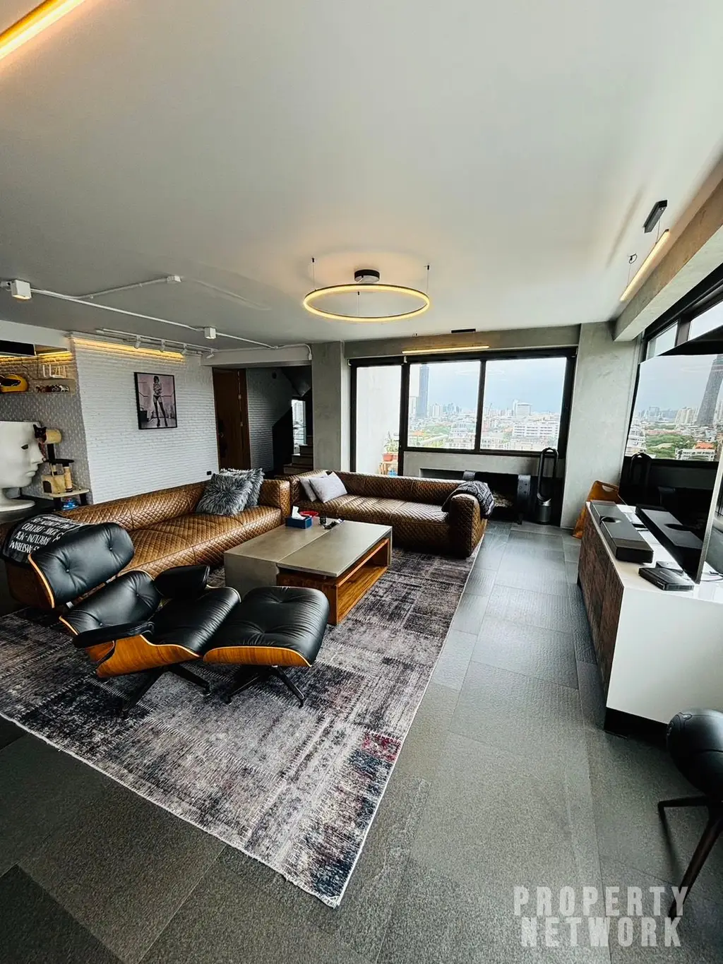 Discover luxury living with this loft-style duplex at The Habitat Sukhumvit 53. Spacious 365 sqm, 3 bedrooms, pet-friendly, and fully renovated. Sale Price: 50M THB. Near BTS Thong Lor