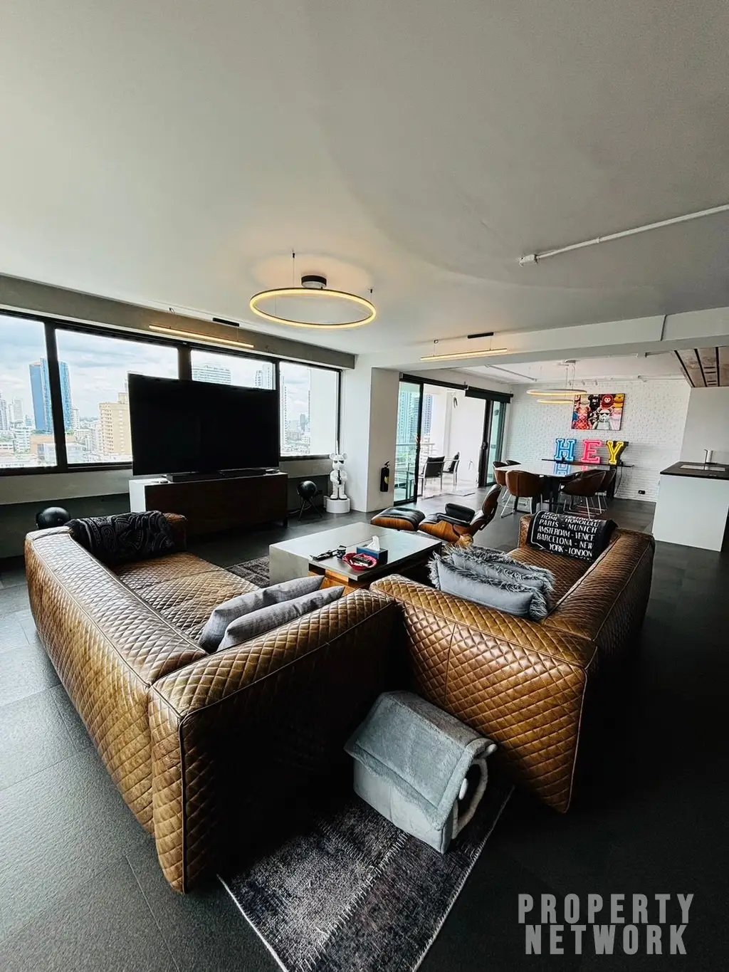 Discover luxury living with this loft-style duplex at The Habitat Sukhumvit 53. Spacious 365 sqm, 3 bedrooms, pet-friendly, and fully renovated. Sale Price: 50M THB. Near BTS Thong Lor