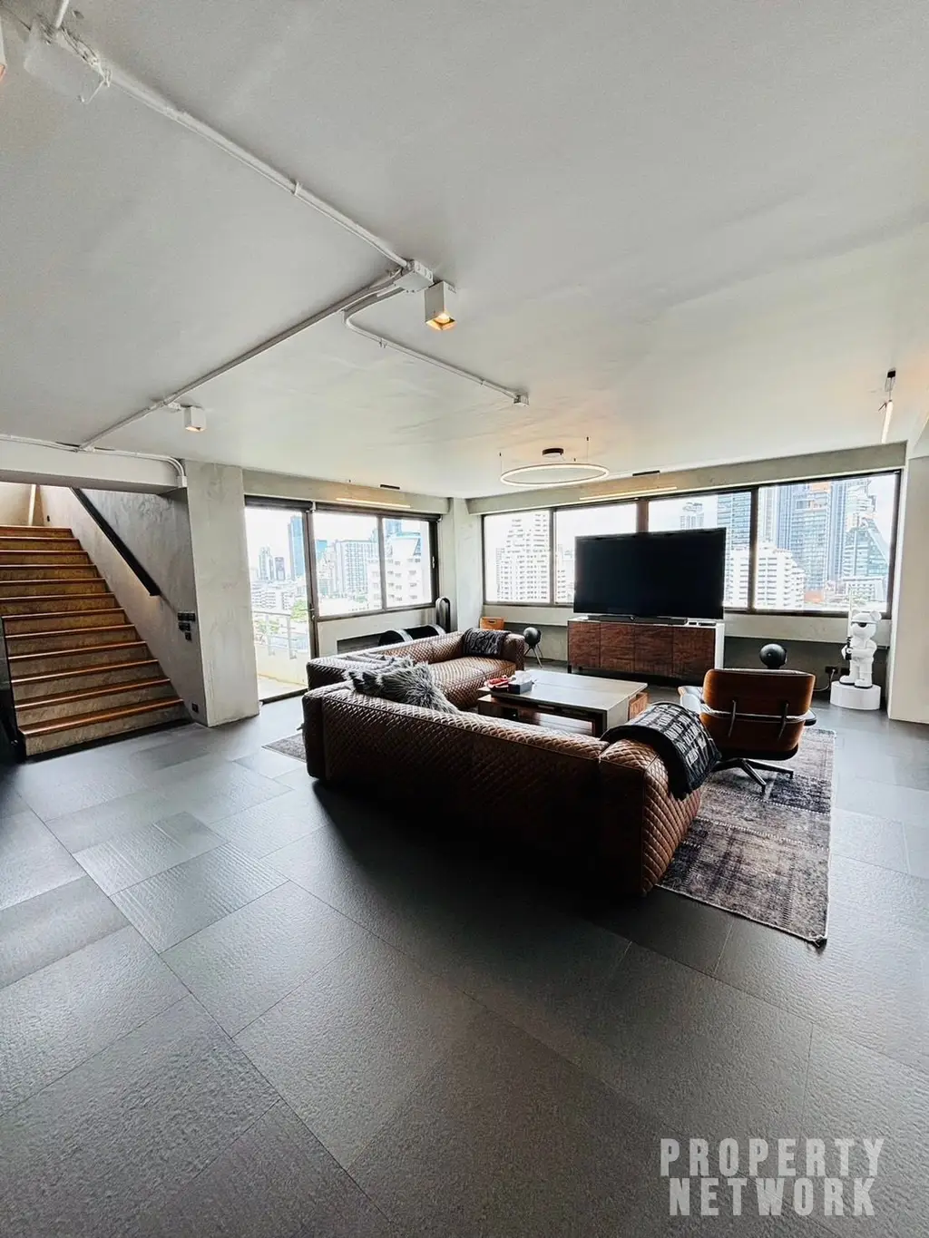 Discover luxury living with this loft-style duplex at The Habitat Sukhumvit 53. Spacious 365 sqm, 3 bedrooms, pet-friendly, and fully renovated. Sale Price: 50M THB. Near BTS Thong Lor