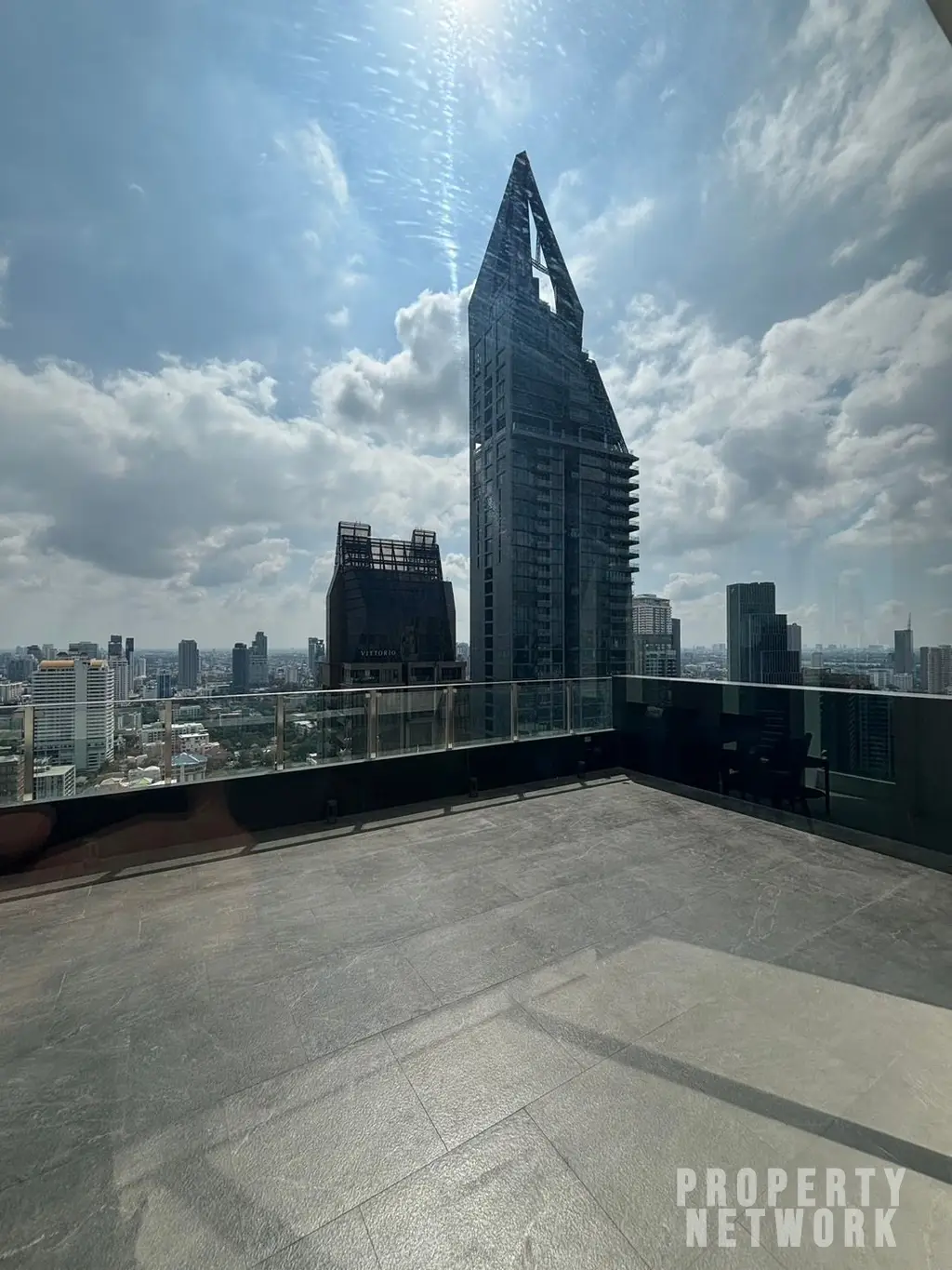 Luxury 4-bedroom, 5-bathroom condo at The Diplomat 39, 450 sqm on the 30th fl. Stunning city views, and high-end amenities. Near BTS Phrom Phong. Sale: 250M THB