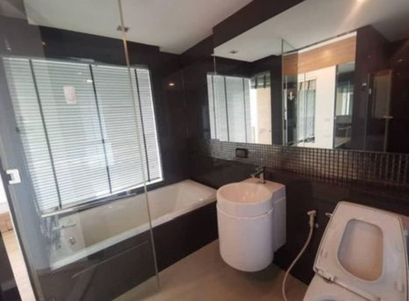 Spacious 2-bedroom condo for rent at Rhythm Sukhumvit 50, fully furnished, 65 sqm, 9th floor, THB 35K/month. Modern amenities and prime location near BTS On Nut