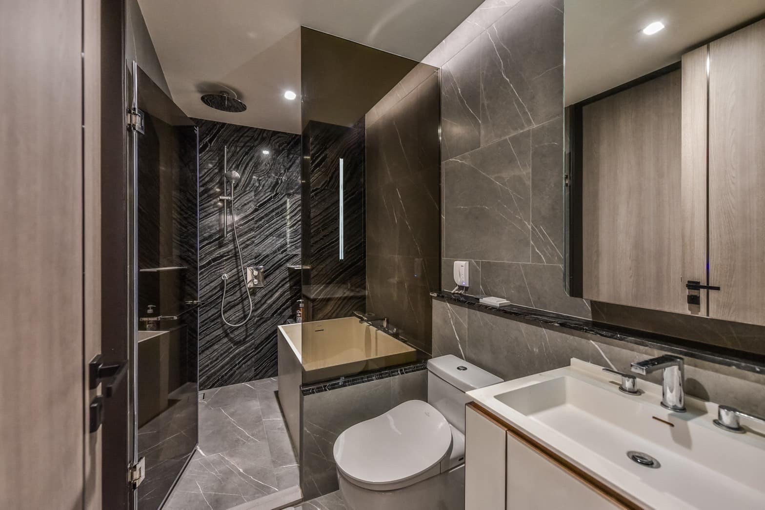 Luxurious 1-bedroom, 1-bathroom condo at The Reserve Sukhumvit 61, 50 sqm, for rent at 55,000 THB. Prime location near BTS Ekkamai, fully furnished.