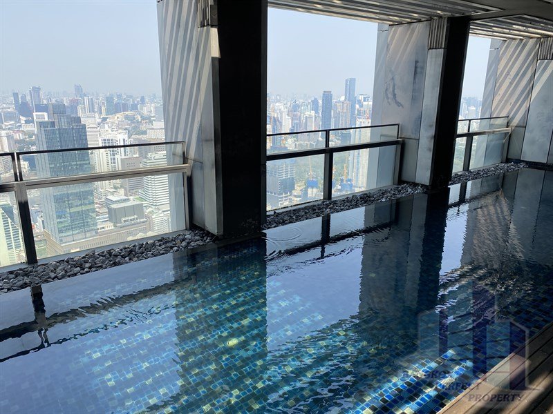 Luxurious 4-bedroom triplex penthouse at The Met Condo Sathorn for rent. Features private lift, pool, salon, and maid’s quarter. Rent 450,000 THB/month.