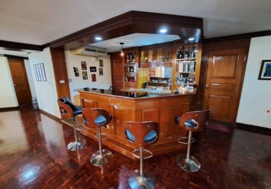 Spacious 4-bedroom condo at Tai Ping Towers, 252 sqm, fully furnished. Prime Ekamai location near BTS. Rent: 60,000 THB/month. Excellent amenities.