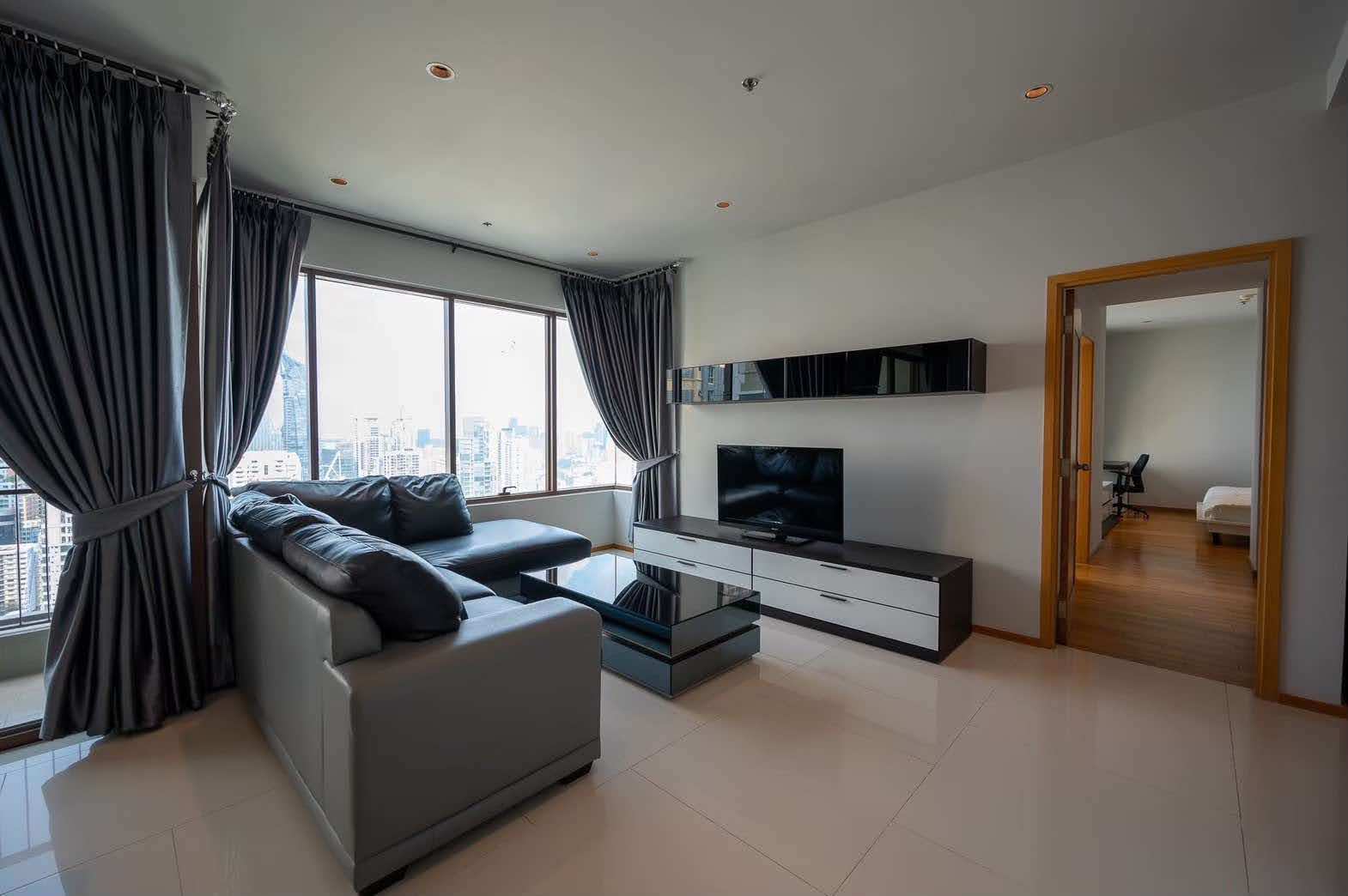 Spacious 2-bed, 2-bath condo at Emporio Place, 105 sqm, fully furnished. For rent at 55,000 THB/month. Great location near Phrom Phong BTS and malls.