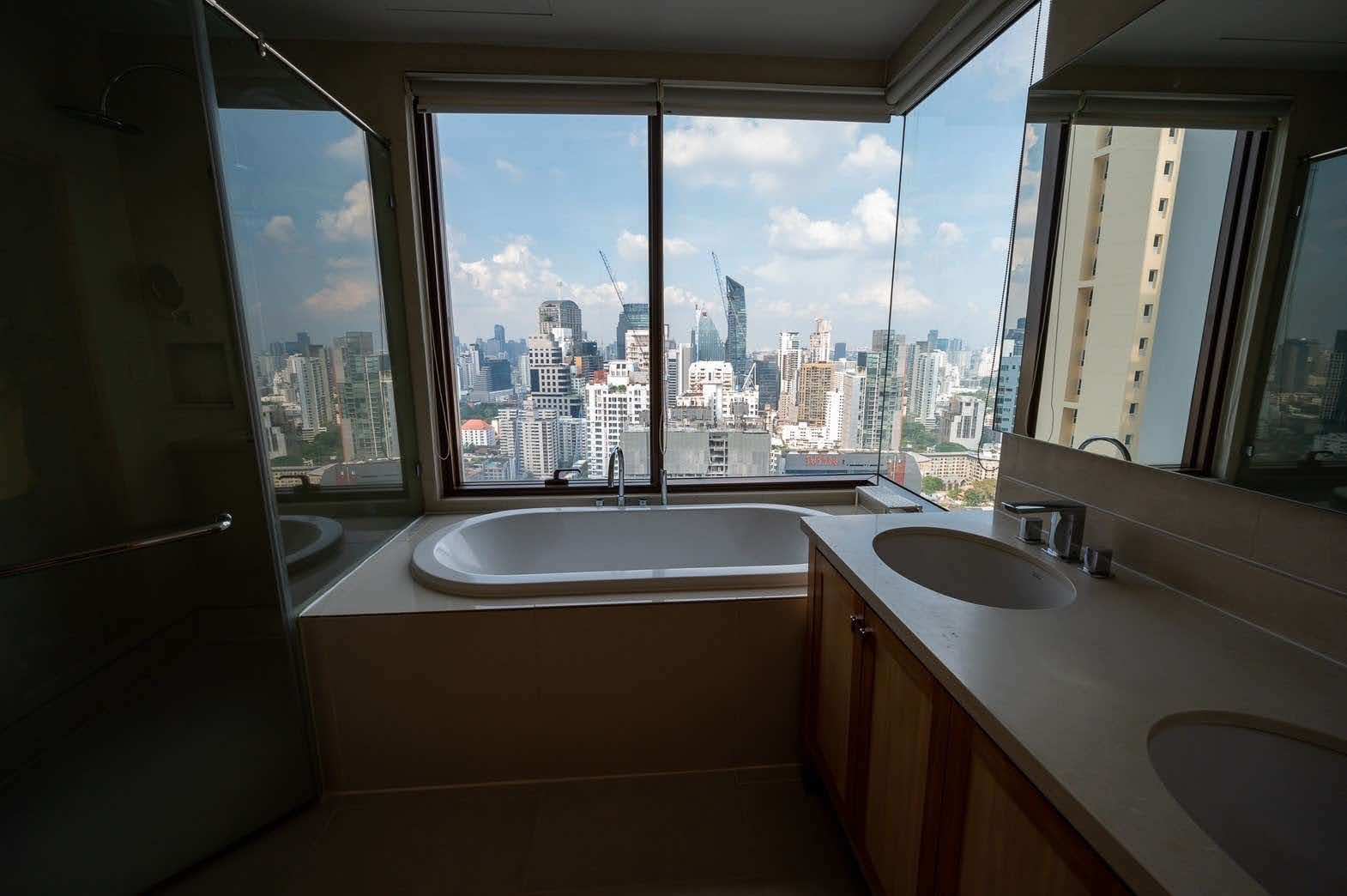 Spacious 2-bed, 2-bath condo at Emporio Place, 105 sqm, fully furnished. For rent at 55,000 THB/month. Great location near Phrom Phong BTS and malls.