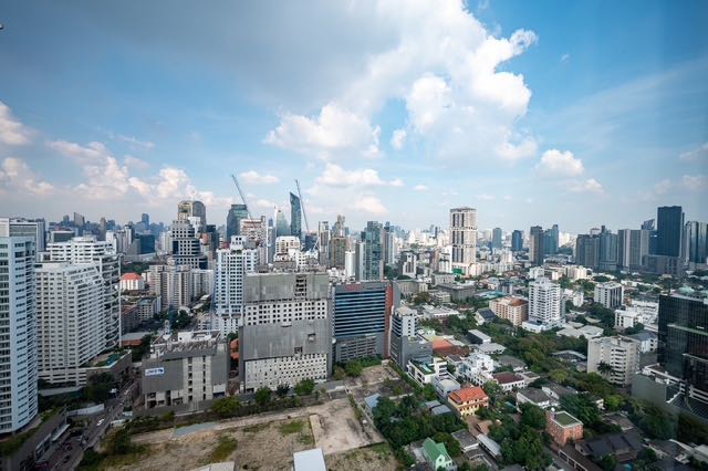 Spacious 2-bed, 2-bath condo at Emporio Place, 105 sqm, fully furnished. For rent at 55,000 THB/month. Great location near Phrom Phong BTS and malls.