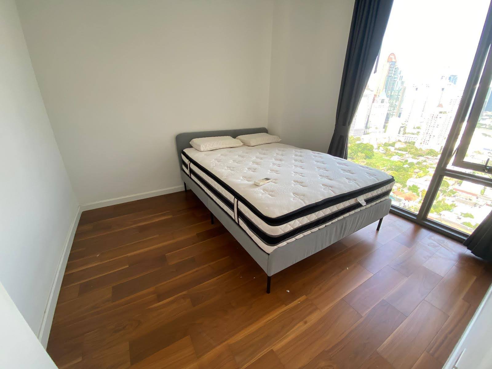 Spacious 2-bed, 2-bath corner unit at Nara 9, 78 sqm, for rent at 50,000 THB/month. Newly renovated with TV & coffee table. Close to Chong Nonsi BTS.