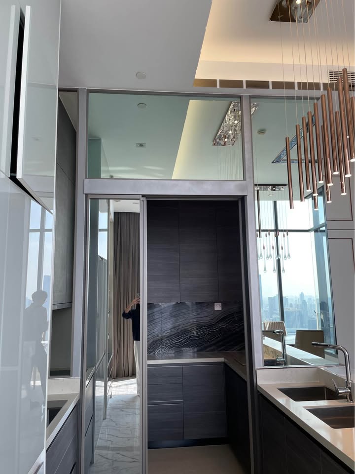 Own a luxurious 157 sqm penthouse at The Esse Asoke, Bangkok. Featuring 2 bedrooms, 3 bathrooms, breathtaking views, and premium amenities. Sale price: 60M THB.