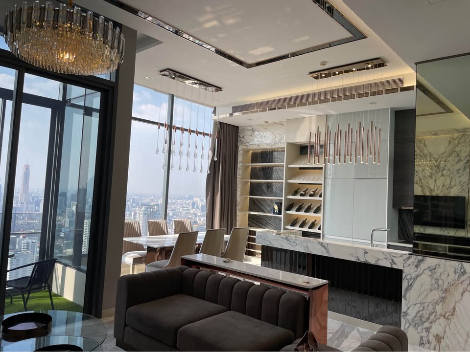 Own a luxurious 157 sqm penthouse at The Esse Asoke, Bangkok. Featuring 2 bedrooms, 3 bathrooms, breathtaking views, and premium amenities. Sale price: 60M THB.