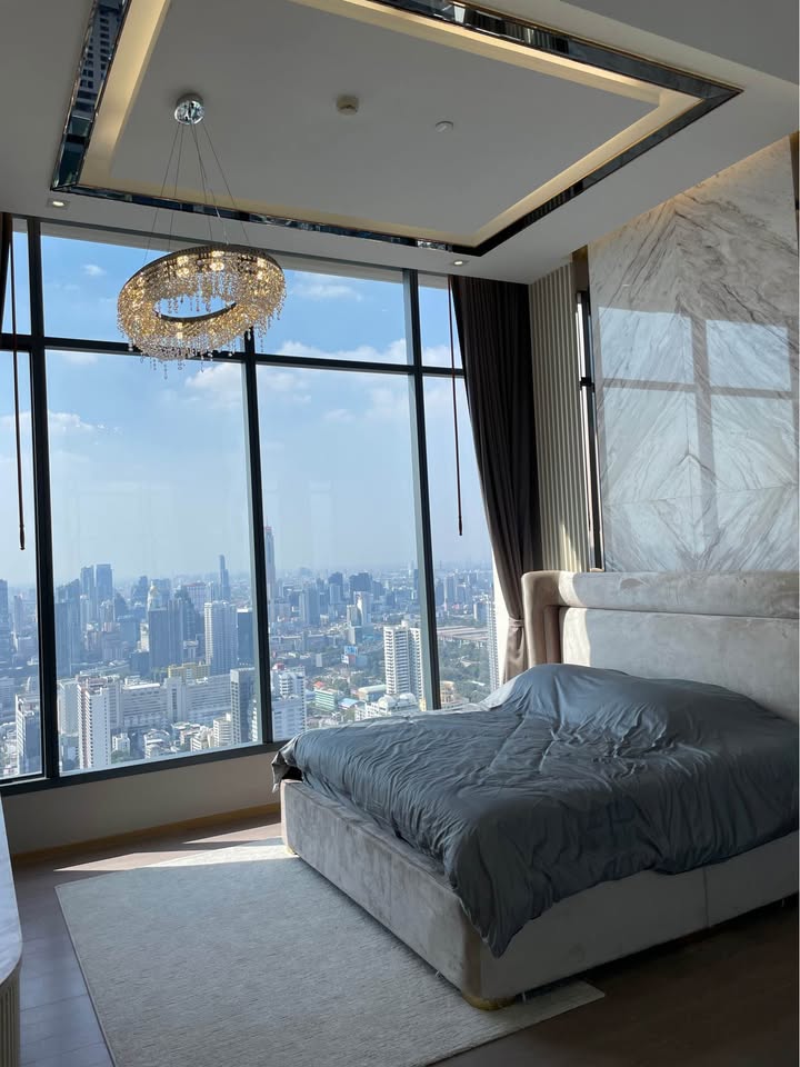 Own a luxurious 157 sqm penthouse at The Esse Asoke, Bangkok. Featuring 2 bedrooms, 3 bathrooms, breathtaking views, and premium amenities. Sale price: 60M THB.