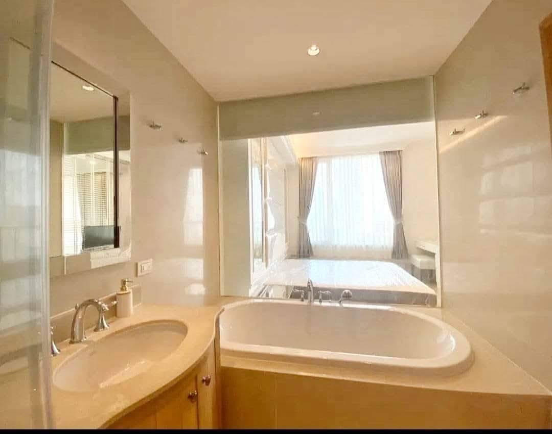 2-bed, 2-bath duplex at The Empire Place Sathorn, near BTS Chong Nonsi, 120 sqm, fully furnished, 60,000 THB/month, available from January 20, 2025.