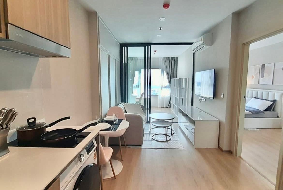 Luxury 2-bedroom, 1-bathroom condo at Life Rama 4-Asoke, 48 sqm, fully furnished with modern decor, high-end appliances, and excellent facilities near MRT Queen Sirikit.