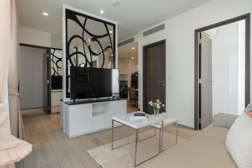 Elegant 2-bedroom condo at Pyne by Sansiri, featuring stylish furnishings, high-floor city views, and premium facilities, located next to BTS Ratchathewi.