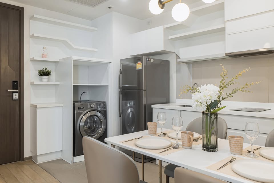Elegant 2-bedroom condo at Pyne by Sansiri, featuring stylish furnishings, high-floor city views, and premium facilities, located next to BTS Ratchathewi.