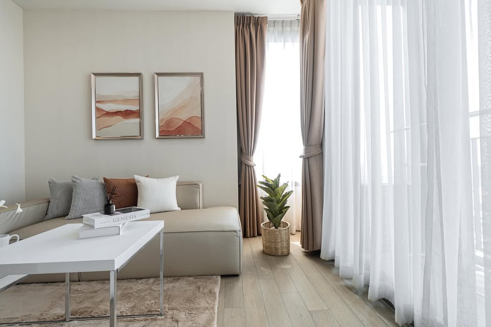 Elegant 2-bedroom condo at Pyne by Sansiri, featuring stylish furnishings, high-floor city views, and premium facilities, located next to BTS Ratchathewi.