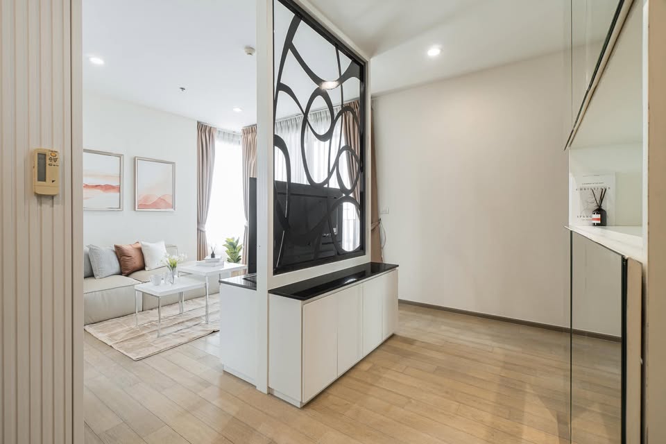 Elegant 2-bedroom condo at Pyne by Sansiri, featuring stylish furnishings, high-floor city views, and premium facilities, located next to BTS Ratchathewi.