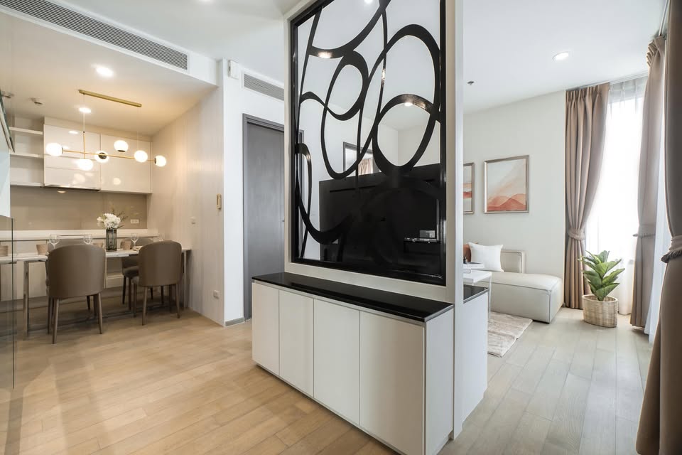Elegant 2-bedroom condo at Pyne by Sansiri, featuring stylish furnishings, high-floor city views, and premium facilities, located next to BTS Ratchathewi.