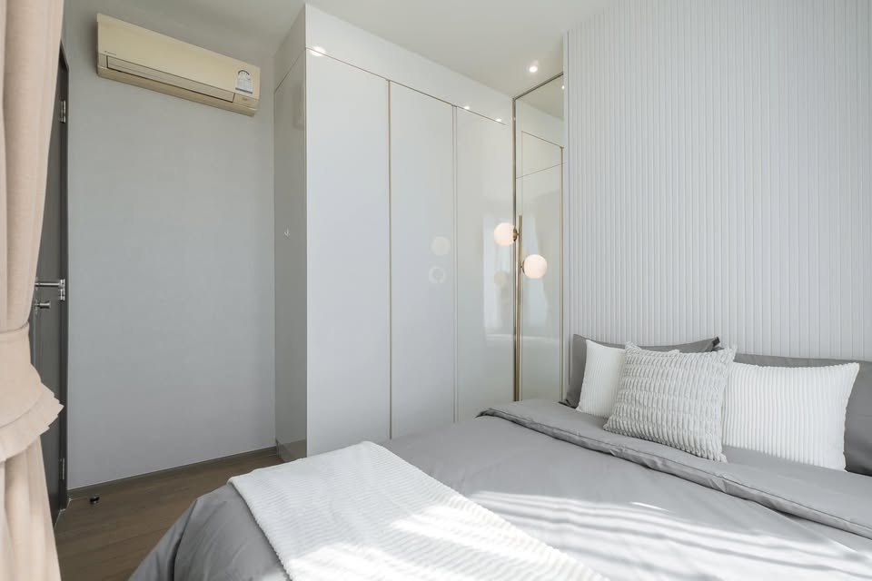 Elegant 2-bedroom condo at Pyne by Sansiri, featuring stylish furnishings, high-floor city views, and premium facilities, located next to BTS Ratchathewi.