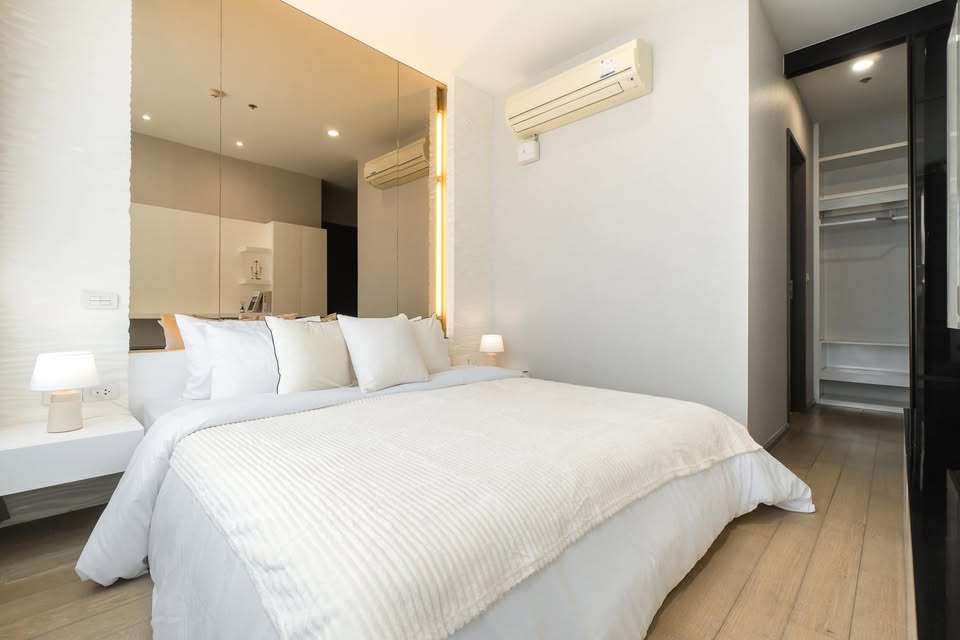 Elegant 2-bedroom condo at Pyne by Sansiri, featuring stylish furnishings, high-floor city views, and premium facilities, located next to BTS Ratchathewi.