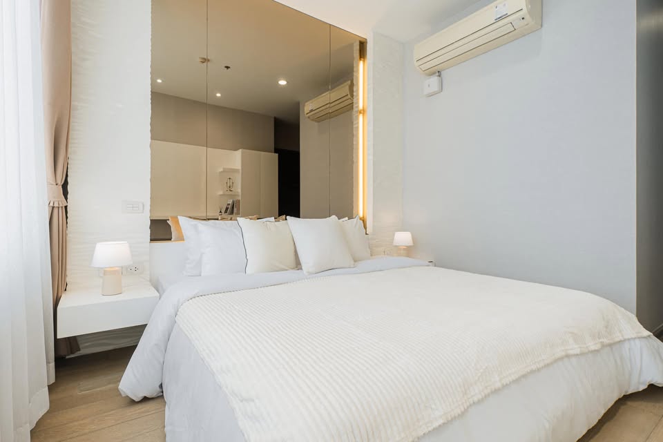 Elegant 2-bedroom condo at Pyne by Sansiri, featuring stylish furnishings, high-floor city views, and premium facilities, located next to BTS Ratchathewi.