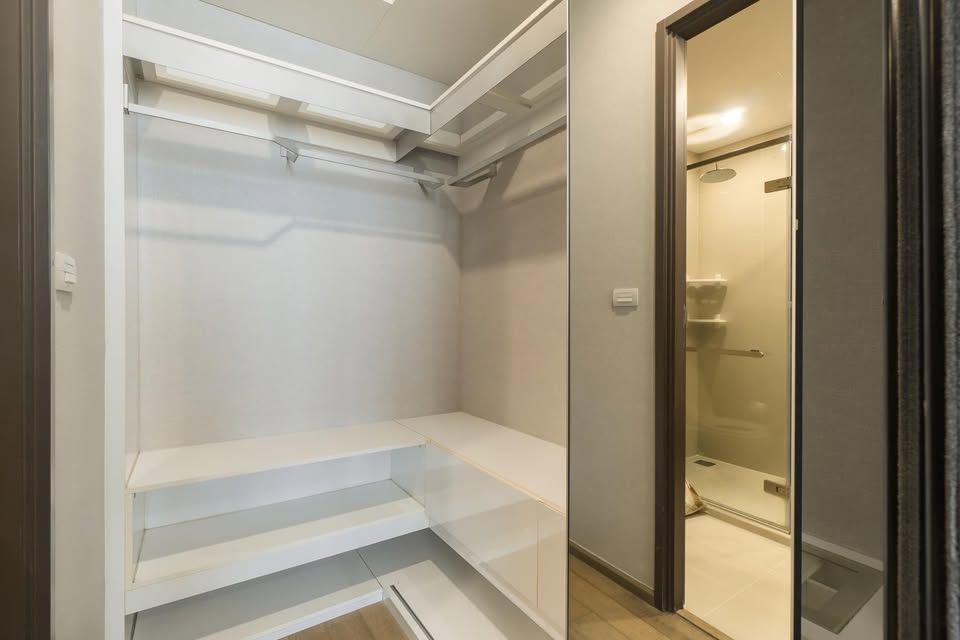 Elegant 2-bedroom condo at Pyne by Sansiri, featuring stylish furnishings, high-floor city views, and premium facilities, located next to BTS Ratchathewi.