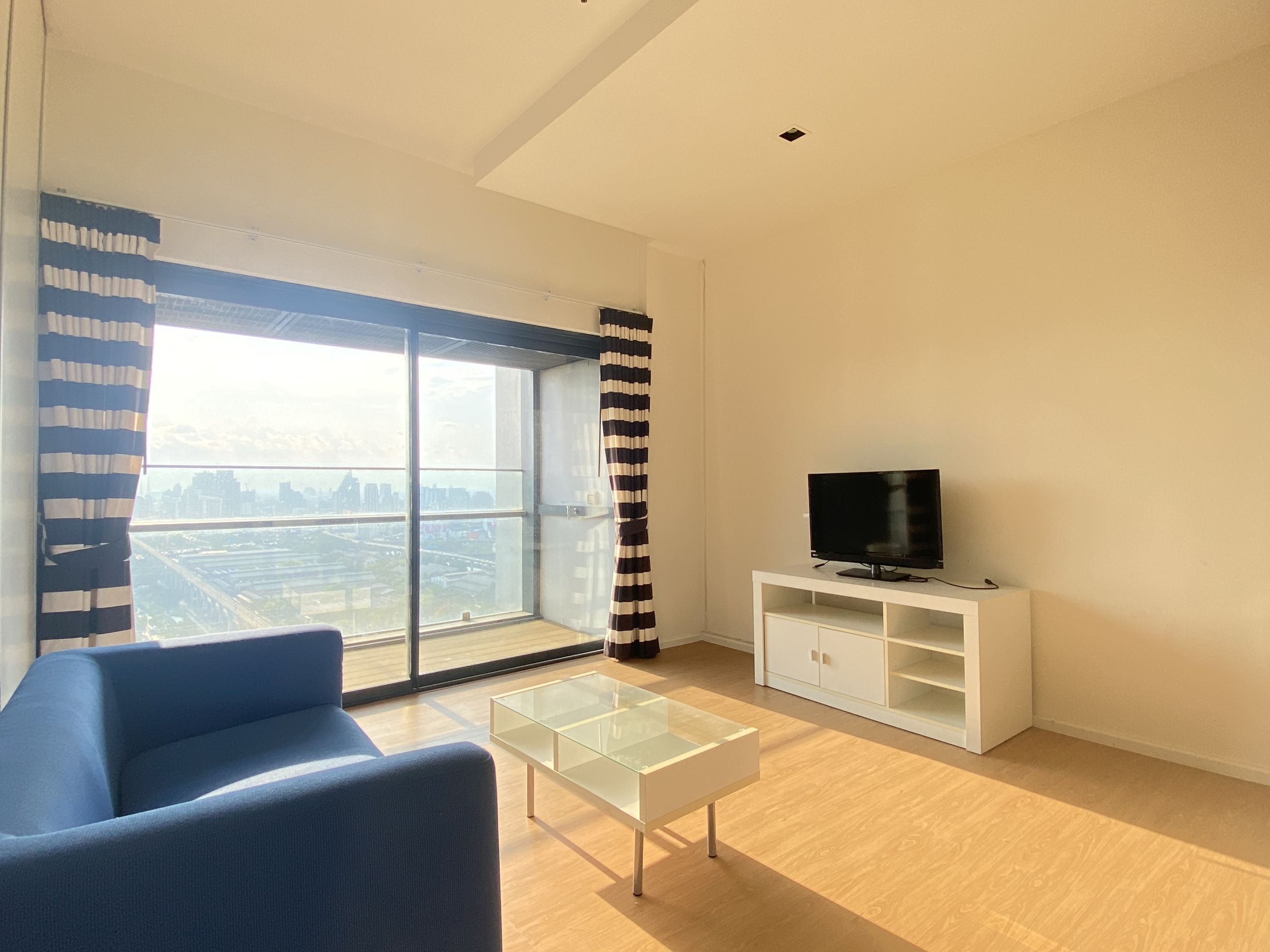 Elegant 1-bedroom condo at Circle Living Prototype with modern furnishings, high-floor city views, and eco-friendly smart home features in Bangkok.
