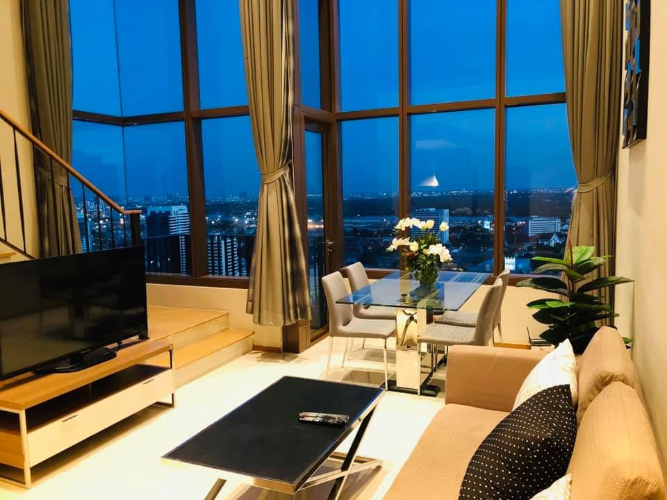 Spacious 1-bed, 2-bath duplex condo at The Emporio Place, 83 sqm, high floor with river view. Prime Sukhumvit 24 location near BTS Phrom Phong. Rent: 55,000 THB/month.