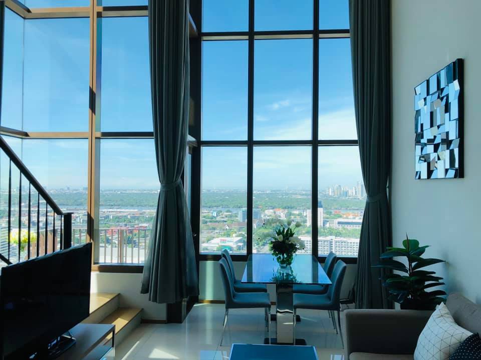 Spacious 1-bed, 2-bath duplex condo at The Emporio Place, 83 sqm, high floor with river view. Prime Sukhumvit 24 location near BTS Phrom Phong. Rent: 55,000 THB/month.