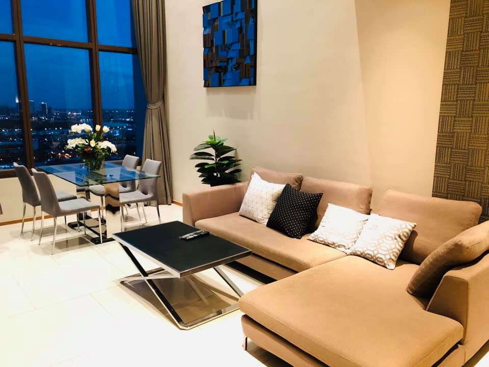 Spacious 1-bed, 2-bath duplex condo at The Emporio Place, 83 sqm, high floor with river view. Prime Sukhumvit 24 location near BTS Phrom Phong. Rent: 55,000 THB/month.