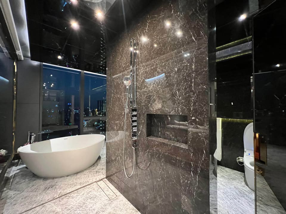 Luxury 3-bed 4-bath 297 sqm condo at MARQUE Sukhumvit with private pool, maid's room, and 4 parking spaces for rent at 700,000 THB monthly near Phrom Phong BTS.