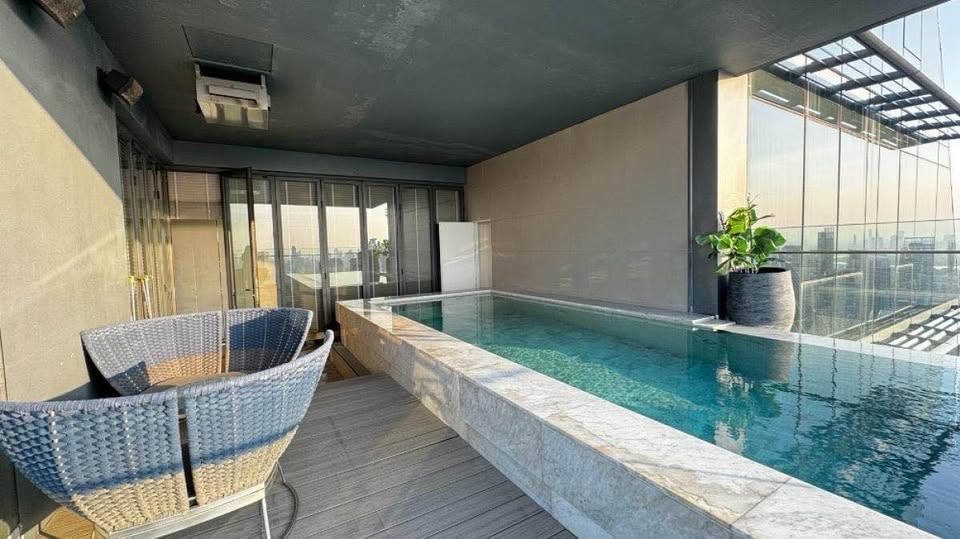 Luxury 3-bed 4-bath 297 sqm condo at MARQUE Sukhumvit with private pool, maid's room, and 4 parking spaces for rent at 700,000 THB monthly near Phrom Phong BTS.