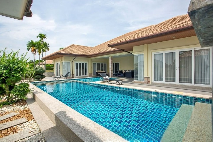 Luxurious 3-bedroom pool villa in Orchid Palm Homes, Hua Hin Soi 88. Fully furnished with private pool and garden. Price: 13,900,000 THB.