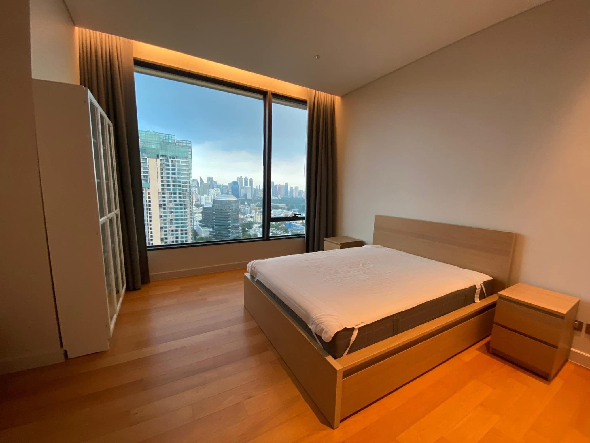 2-Bedrooms 2-Bathrooms 114 sqm condo at Sindhorn Residence for Rent 125,000 THB/Month or For Sale 28.9M THB. Prime Langsuan location, 3m ceilings, garden views.