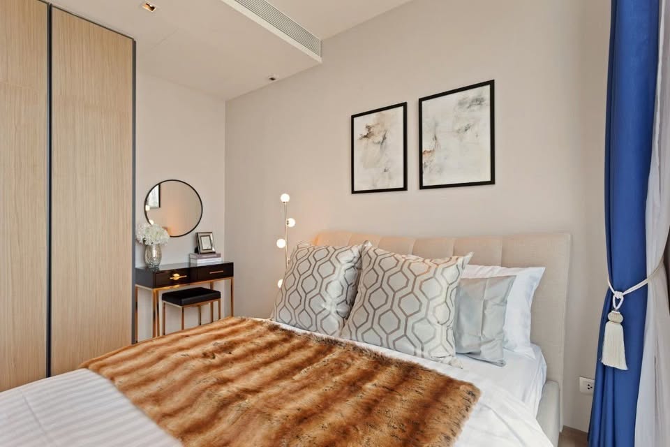 Luxury 2-bedroom condo at BEATNIQ Sukhumvit 32 for sale 21.5M THB. Cheapest unit in the building! High floor, smart home, near BTS. Great investment deal!