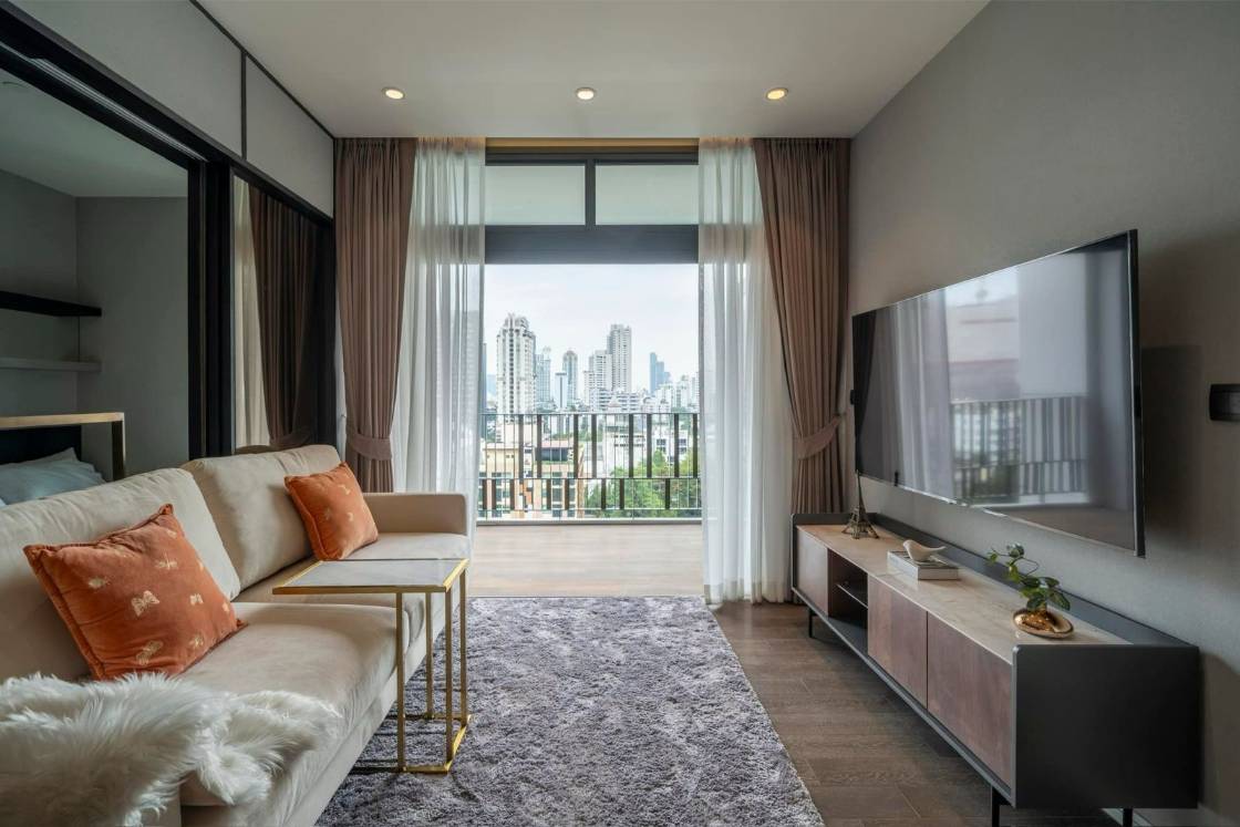 Luxury 2-bedroom condo at MUNIQ Sukhumvit 23, 86 sqm, 12th floor, prime Sukhumvit location. High-end facilities, near BTS Asoke. For rent at 100,000 THB/month.