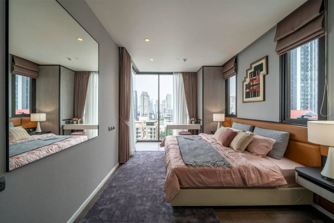 Luxury 2-bedroom condo at MUNIQ Sukhumvit 23, 86 sqm, 12th floor, prime Sukhumvit location. High-end facilities, near BTS Asoke. For rent at 100,000 THB/month.