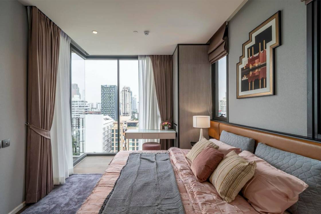 Luxury 2-bedroom condo at MUNIQ Sukhumvit 23, 86 sqm, 12th floor, prime Sukhumvit location. High-end facilities, near BTS Asoke. For rent at 100,000 THB/month.
