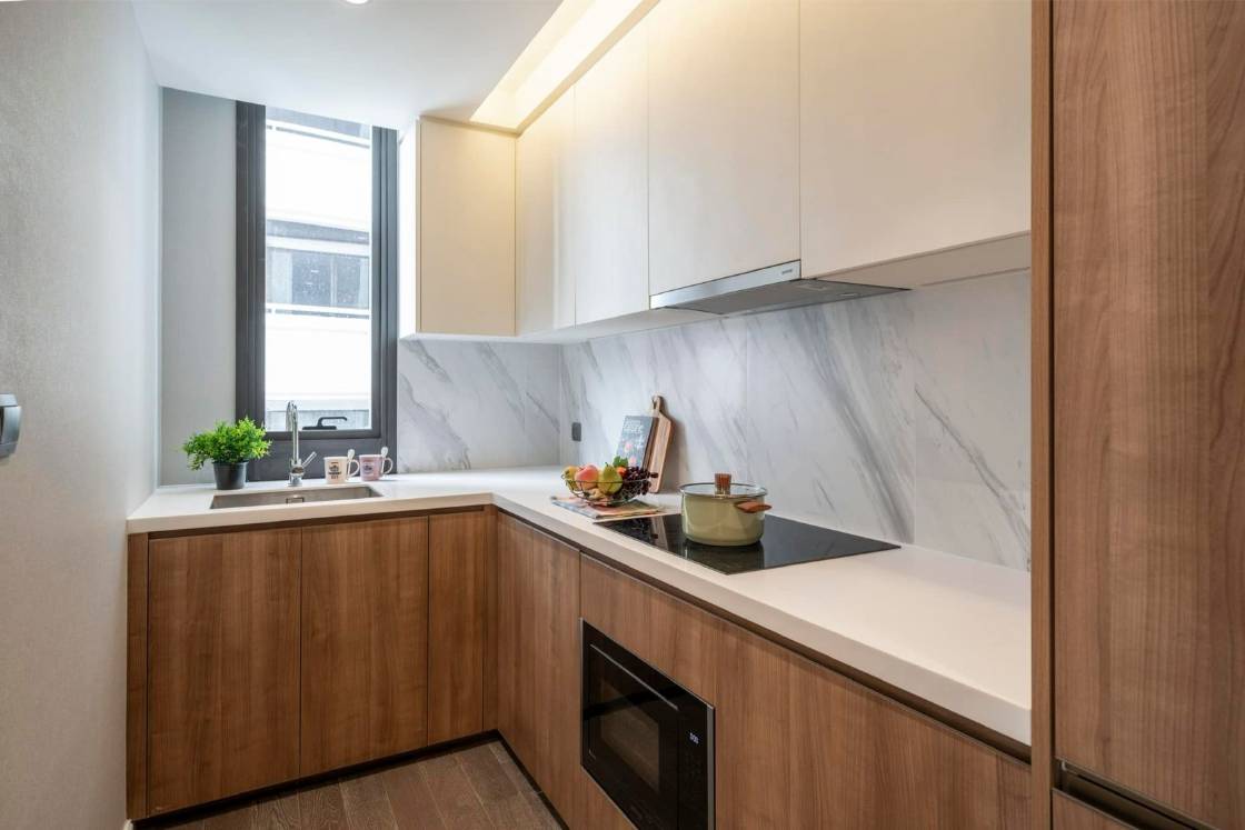 Luxury 2-bedroom condo at MUNIQ Sukhumvit 23, 86 sqm, 12th floor, prime Sukhumvit location. High-end facilities, near BTS Asoke. For rent at 100,000 THB/month.