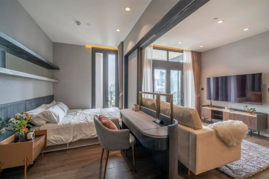 Luxury 2-bedroom condo at MUNIQ Sukhumvit 23, 86 sqm, 12th floor, prime Sukhumvit location. High-end facilities, near BTS Asoke. For rent at 100,000 THB/month.
